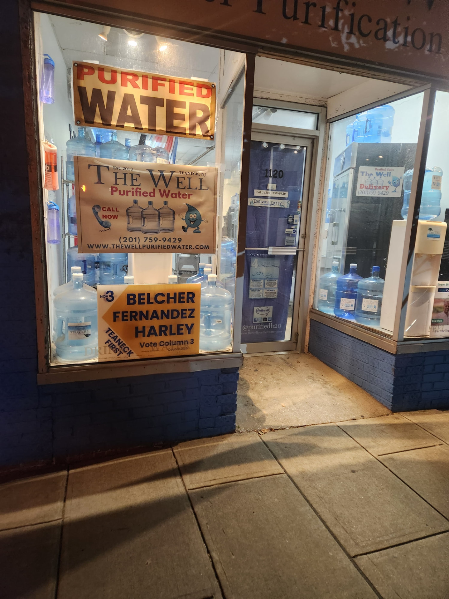Teaneck First sign in the window of The Well Purified Water