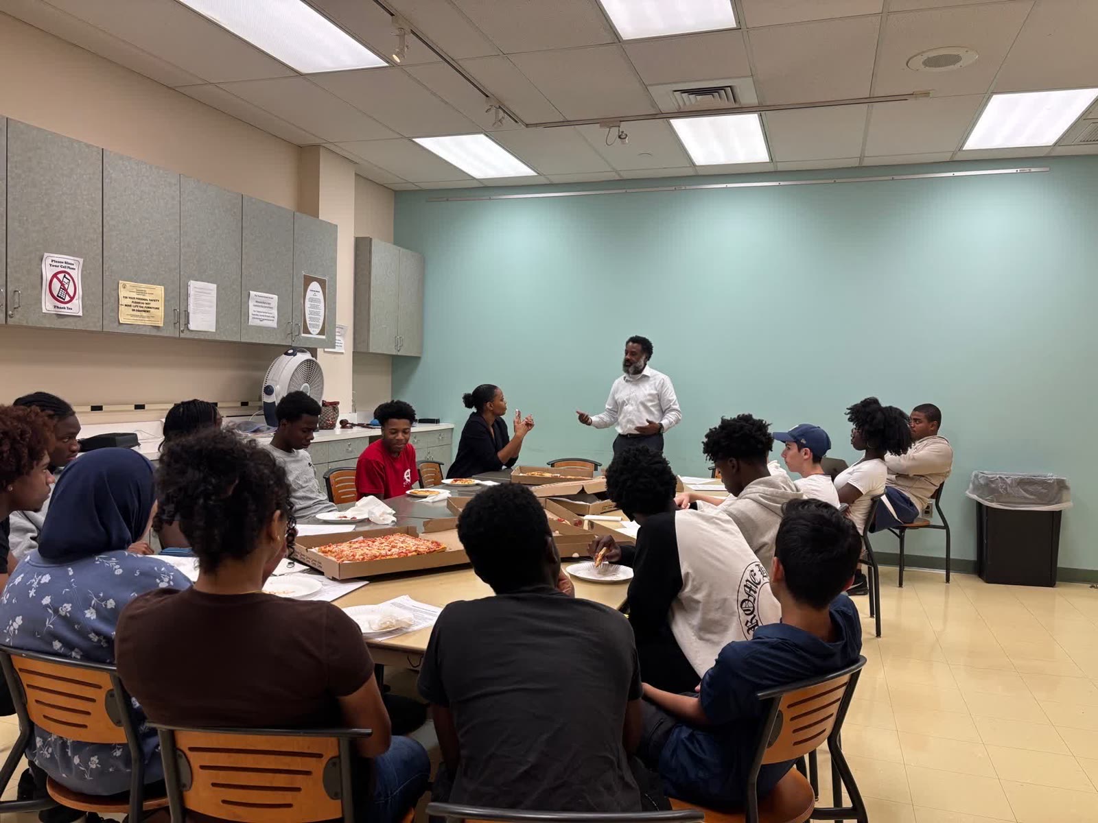 Teaneck First talking with young people at a community meeting
