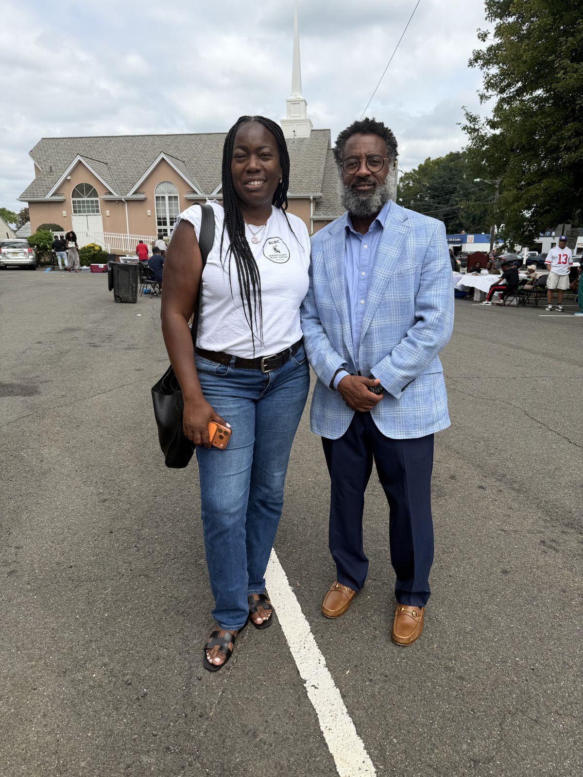 George Fernandez Jr. with a supporter on a neighborhood visit