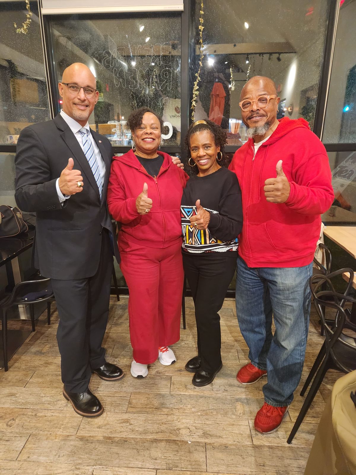 Teaneck First giving a thumbs-up with supporters at a local restaurant