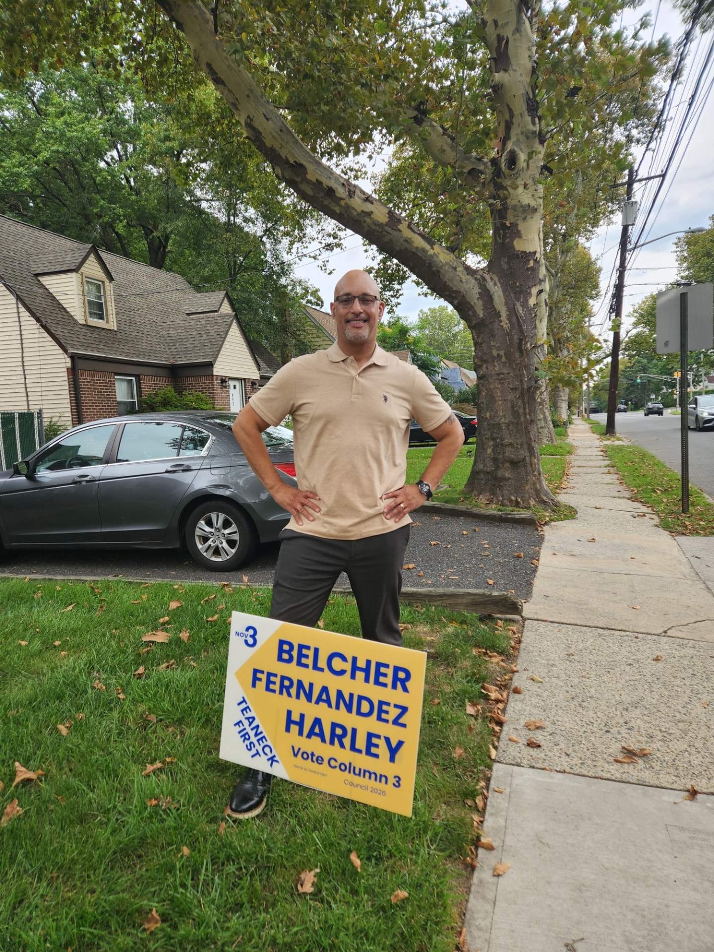 George Fernandez Jr. with a Teaneck First yard sign