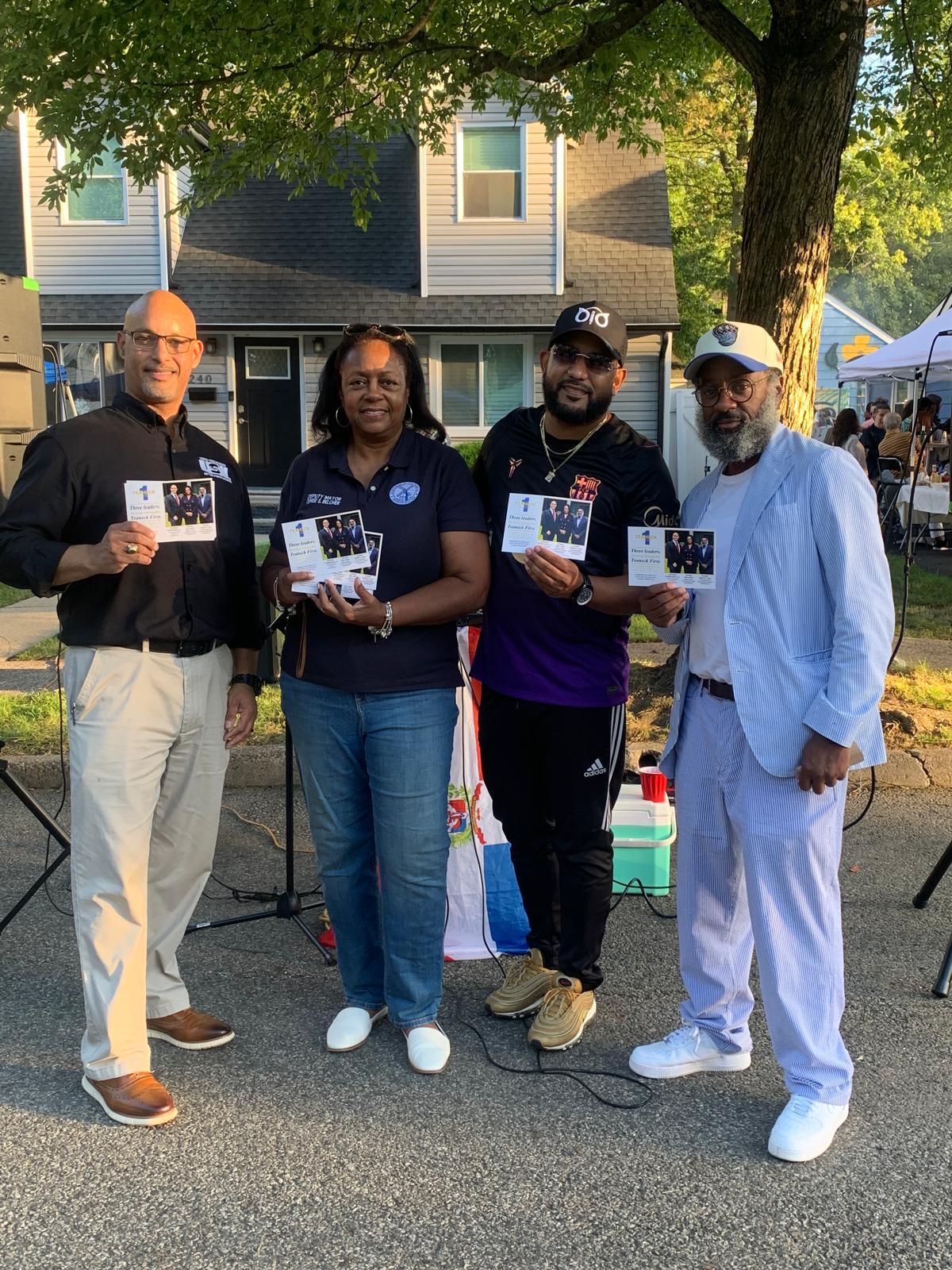 The Teaneck First slate greeting neighbors at a community event