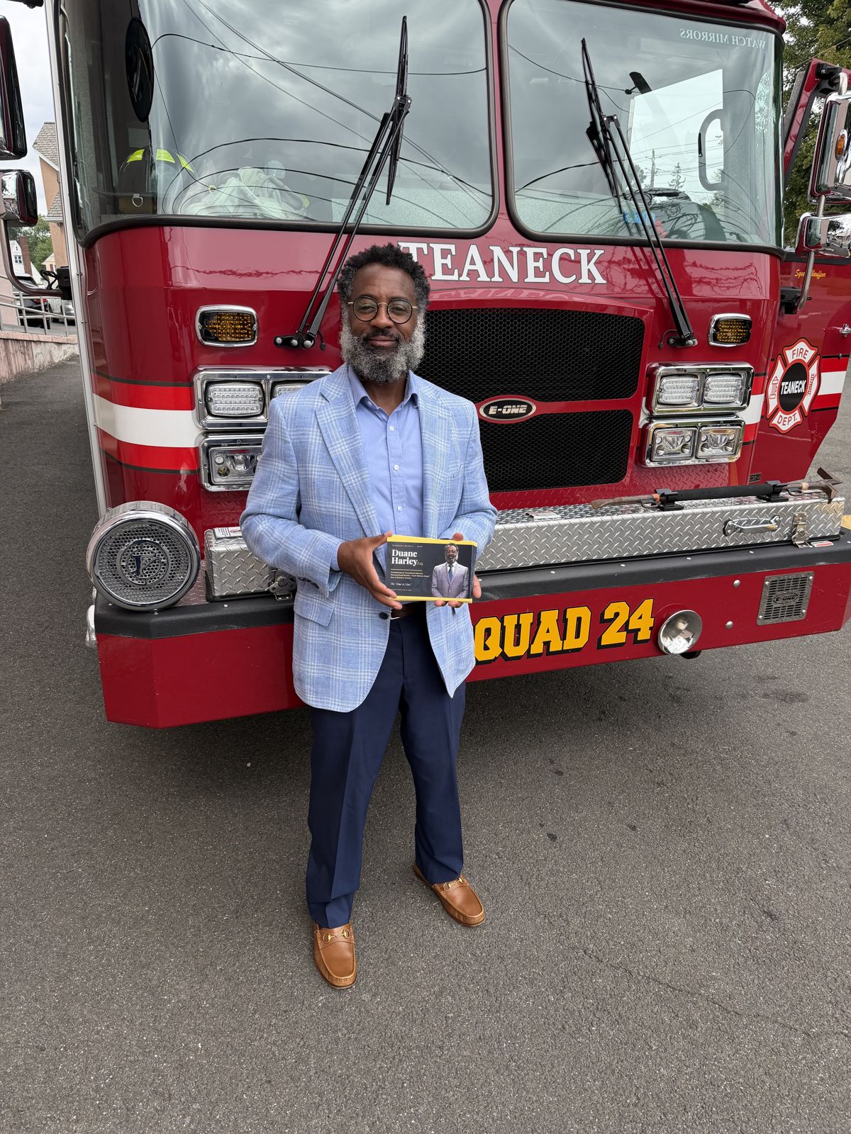 George Fernandez Jr. with a Teaneck Fire Department engine