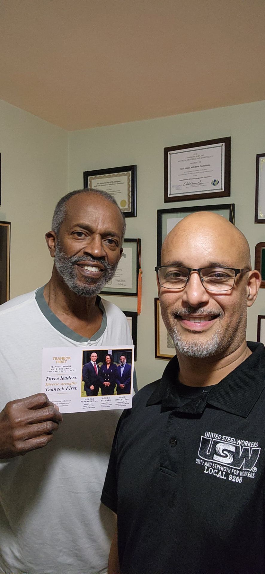 A Teaneck First candidate and supporter showing the campaign mailer